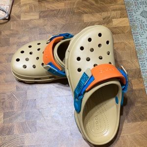 Tan and teal blue crocs worn once